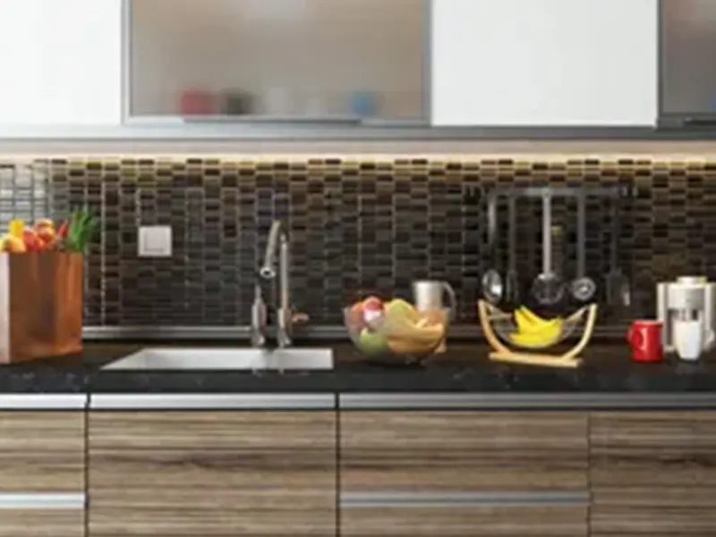 A kitchen with a sink and a counter top