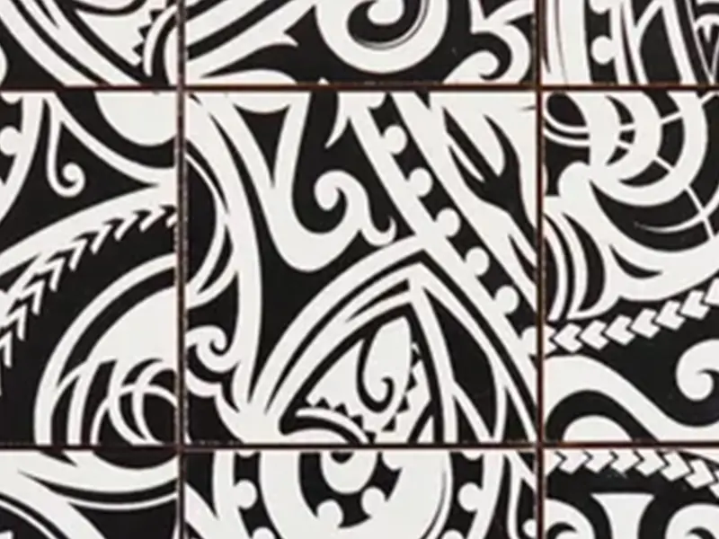 A black and white tile pattern with some designs on it