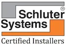 Logo of Schluter Systems Certified Installers, featuring grey and orange geometric shapes with the company name in black text.